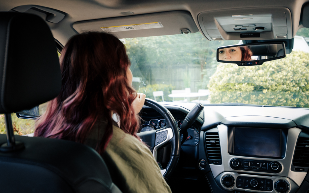 woman driving car | benefits of defensive driving