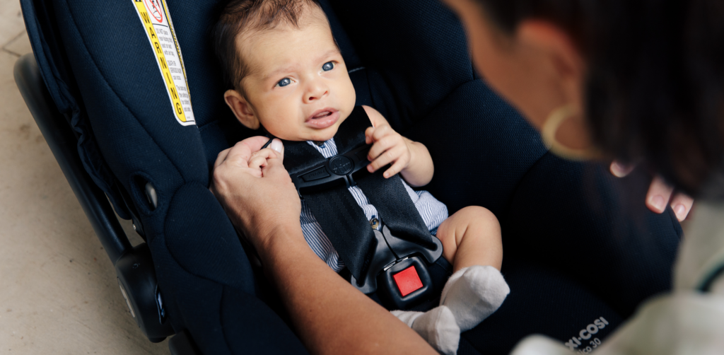Baby Harnessed in Car Seat